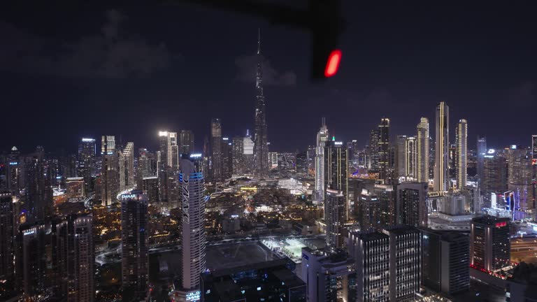 Nighttime cityscape with skyscrapers, showcasing Emaar Valley Phase 2's advanced surveillance and security systems.