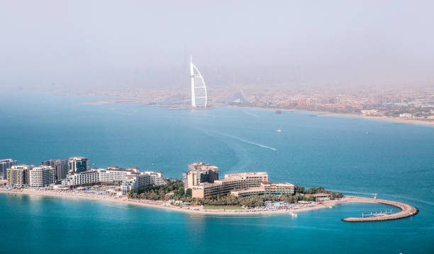 Aerial view of Dubai's coastline with luxury buildings, highlighting potential risks in the property market.