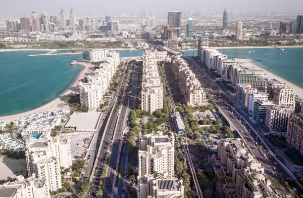 Aerial view of residential and commercial buildings along the waterfront in Dubai.