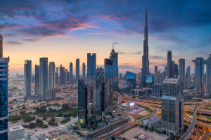 A stunning view of Dubai's diverse real estate featuring skyscrapers and iconic landmarks at sunset.